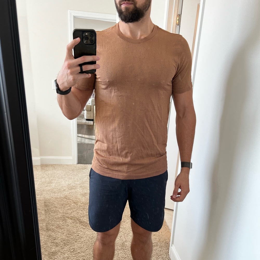 Lululemon Tshirt (not sure style). Medium pictured. Orange-ish in color.